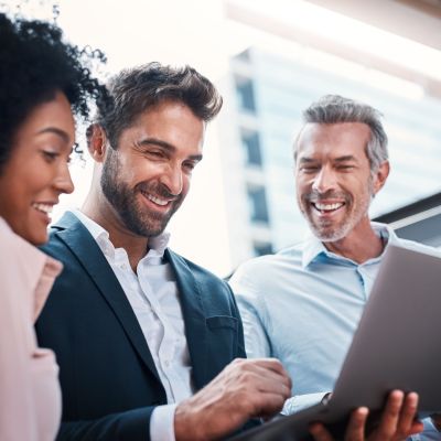 Business,People,,Laptop,And,Laughing,For,Research,In,Collaboration,For